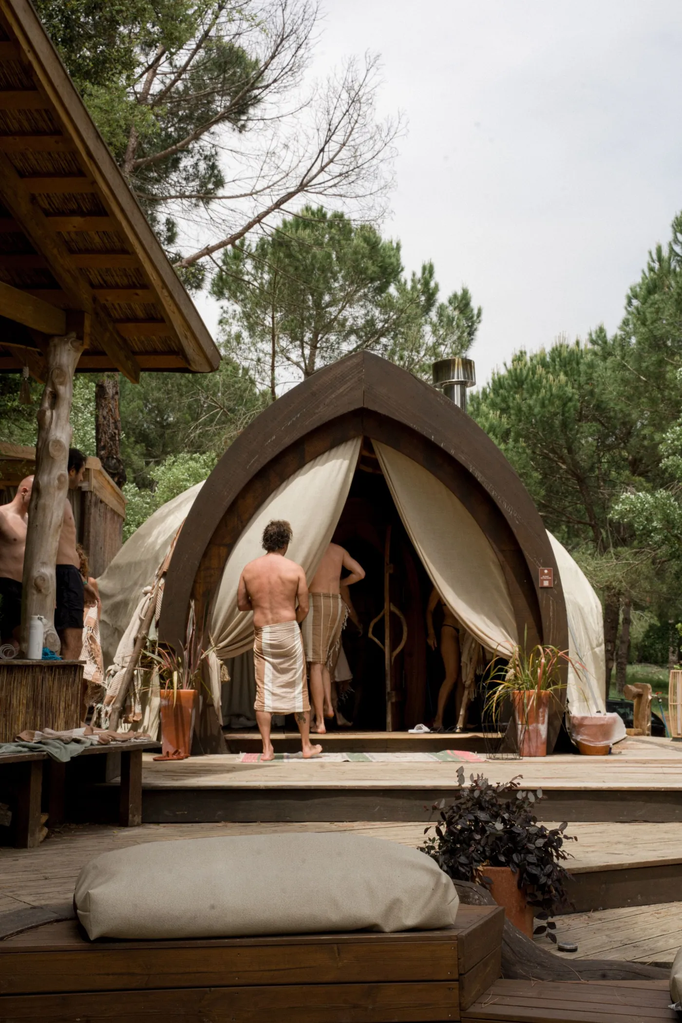 Guests entering the ATMOS steam dome in the forest